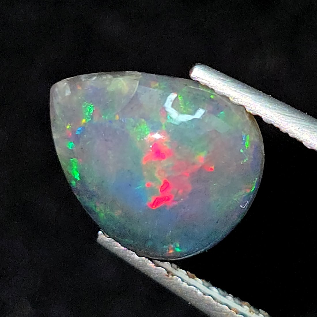 1.54 Ct "Play Of Colors" Natural Black Opal: Gemstones: Natural Black Fire Opal /Carat Weights: 1.54 ct /Size or Dimensions: 10.60 X 8.60 X 3.90 mmTreatment: Heated