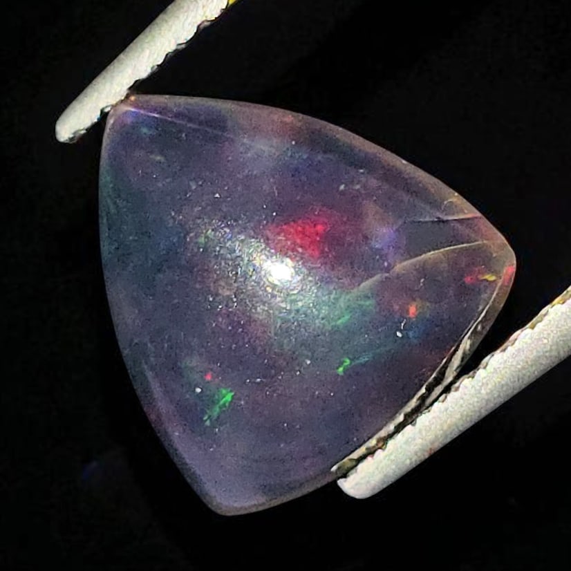 1.58 Ct "Play Of Colors" Natural Black Opal: Gemstones: Natural Black Fire Opal /Carat Weights: 1.58 ct /Size or Dimensions: 9.50 X 9 X 4.30 mmTreatment: Heated