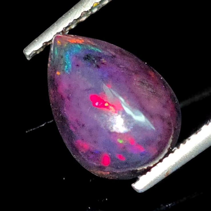 1.35 Ct "Play Of Colors" Natural Black Opal: Gemstones: Natural Black Fire Opal /Carat Weights: 1.35 ct /Size or Dimensions: 10.20 X 7 X 4.40 mmTreatment: Heated