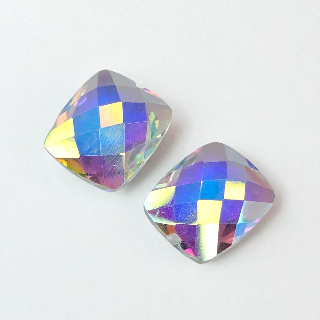 9.54 ct Natural Mercury Glow Mystic Topaz Drilled Pair: Gemstones: Natural Mystic Topaz /Carat Weights: 9.54 ct /Size or Dimensions: 12 X 10 mm /Treatment: Coated