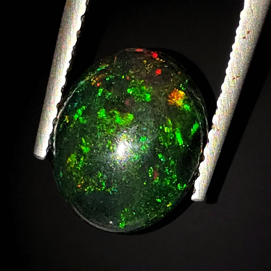 1.25 Ct "Play Of Colors" Natural Black Opal: Gemstones: Natural Black Fire Opal /Carat Weights: 1.25 ct /Size or Dimensions: 9.80 X 8 X 3.80 mmTreatment: Heated