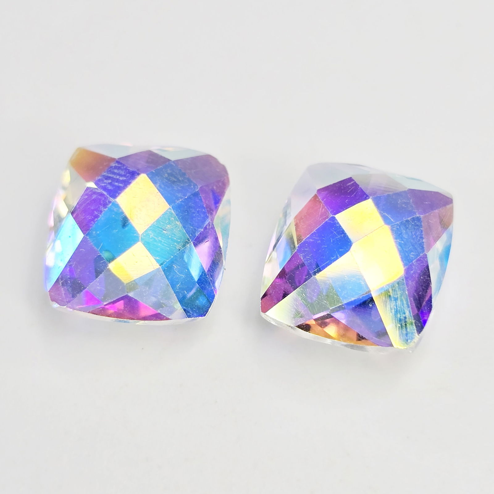 9.46 ct Natural Mercury Glow Mystic Topaz Drilled Pair: Gemstones: Natural Mystic Topaz /Carat Weights: 9.46 ct /Size or Dimensions: 12 X 10 mm /Treatment: Coated