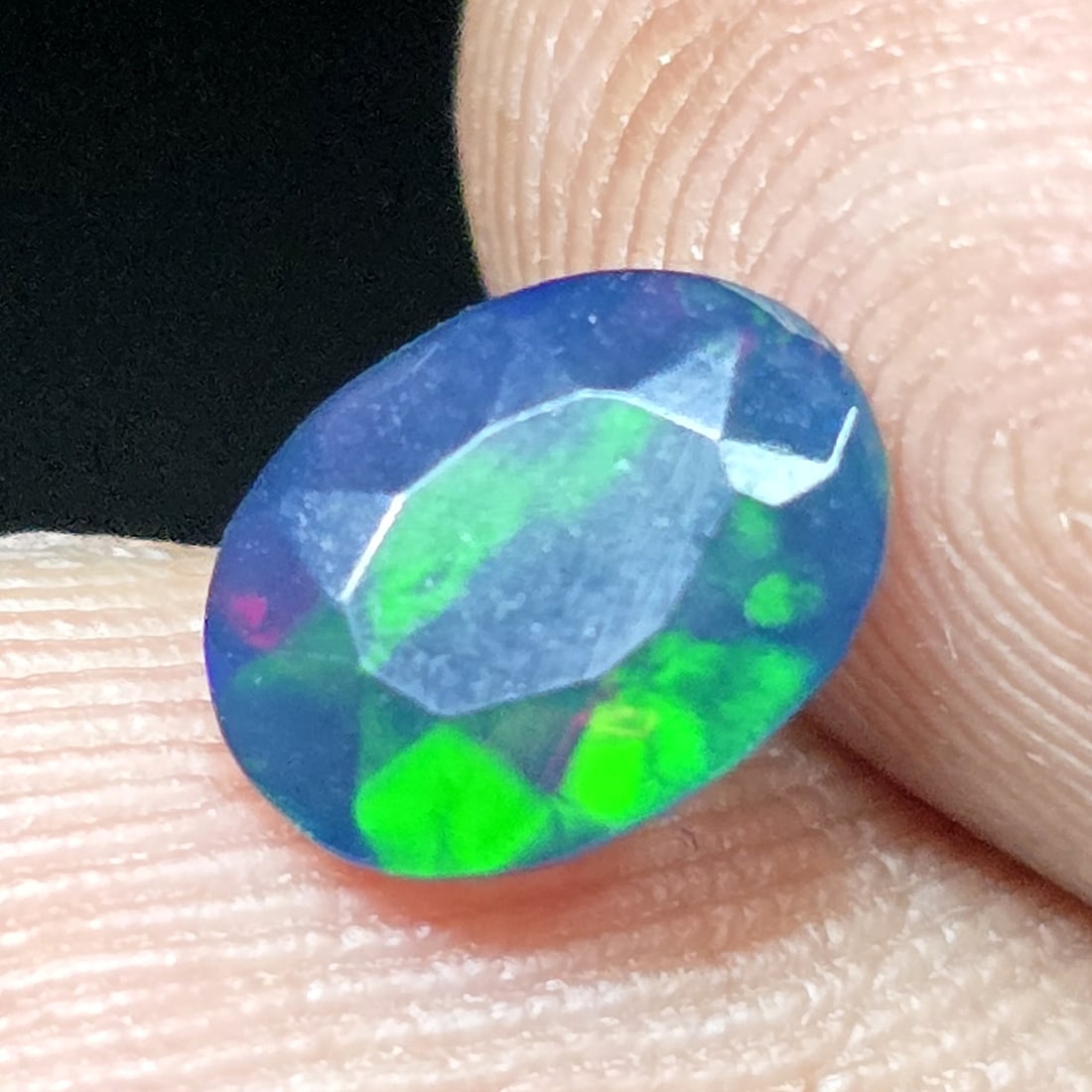0.73 Ct "Play Of Colors" Natural Black Opal Cut: Gemstones: Natural Black Fire Opal /Carat Weights: 0.73 ct /Size or Dimensions: 8 X 6 X 3.60 mmTreatment: Heated