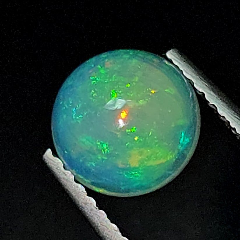 1.29 Ct "Play of Colors" Natural Ethiopian Fire Opal: Gemstones: Natural Fire Opal /Carat Weights: 1.29 ct /Size or Dimensions: 7 X 7 mm /Treatment: No