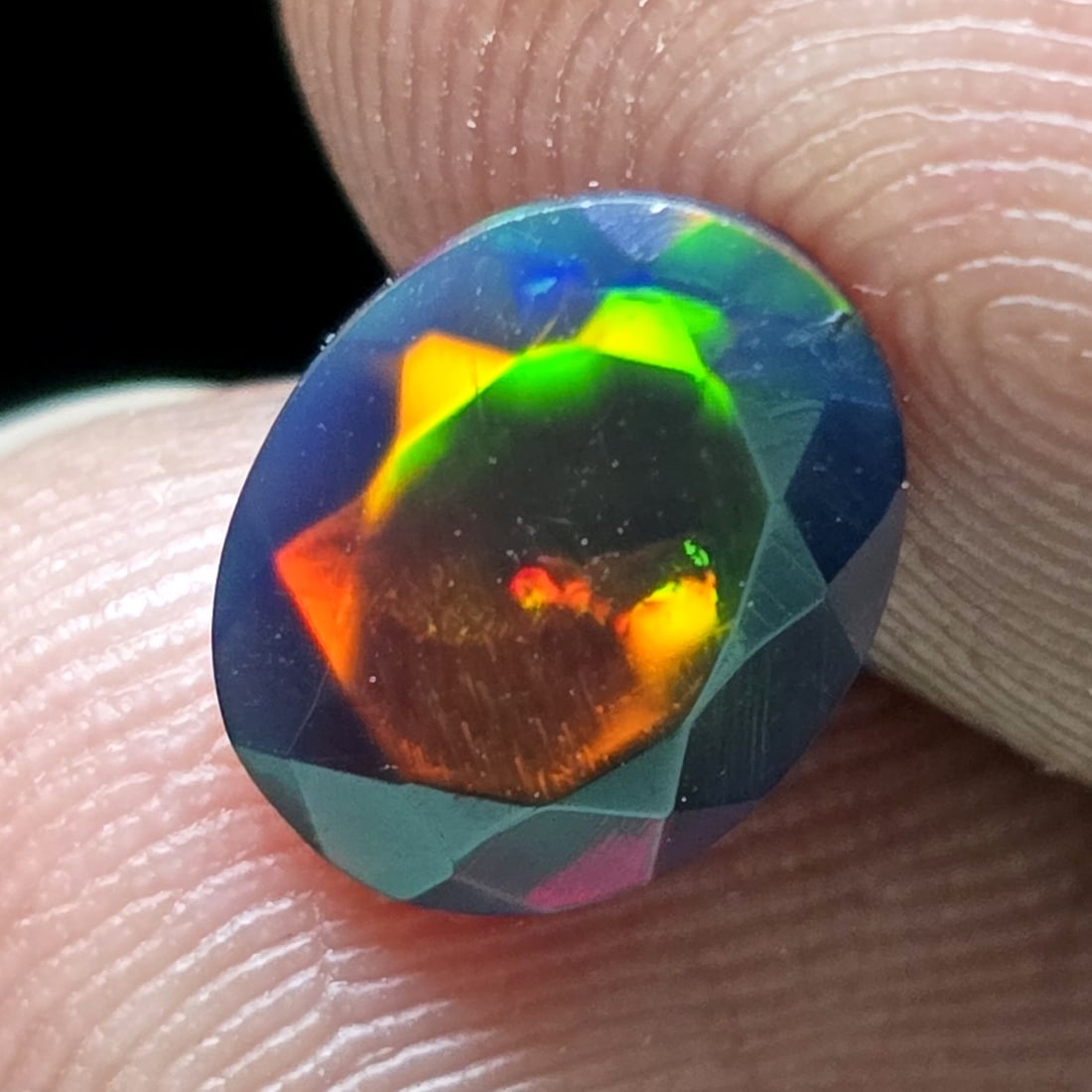 1.27 Ct "Play Of Colors" Natural Black Opal Cut: Gemstones: Natural Black Fire Opal /Carat Weights: 1.27 ct /Size or Dimensions: 9 X 7 X 4.30 mm /Treatment: Heated