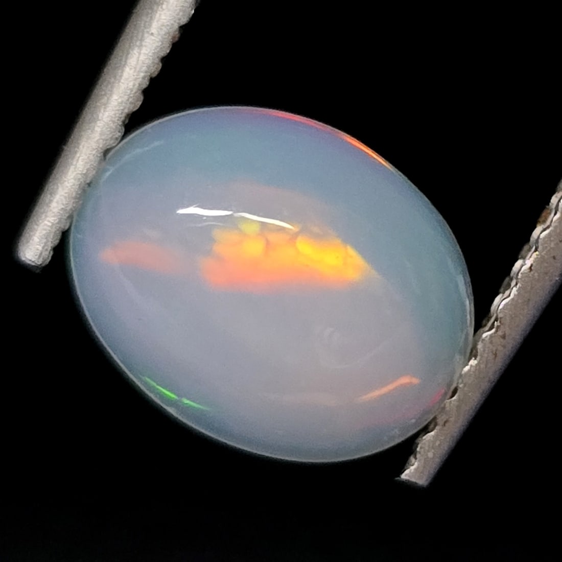 0.98 Ct "Play of Colors" Natural Ethiopian Fire Opal: Gemstones: Natural Fire Opal /Carat Weights: 0.98 ct /Size or Dimensions: 0.98 mm /Treatment: No