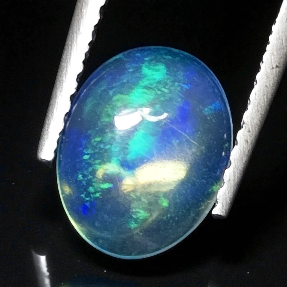 0.81 Ct Natural Ethiopian Green Fire Opal (1 of 5)