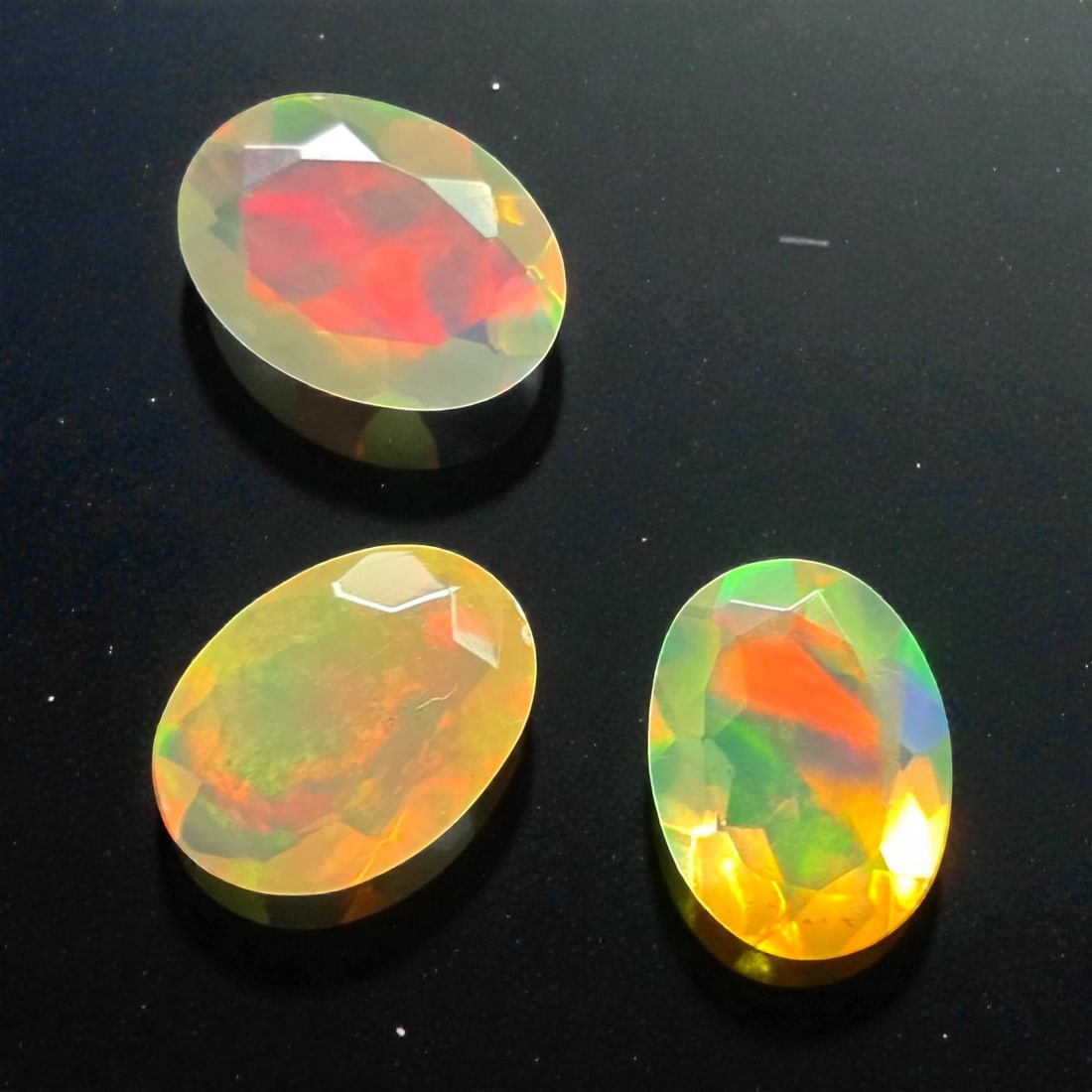 1.30 Ct "Play of Colors" Natural Ethiopian Fire Opal Cut: Gemstones: Natural Fire Opal /Carat Weights: 1.30 ct /Size or Dimensions: 7 X 5 X 3 mm /Treatment: No