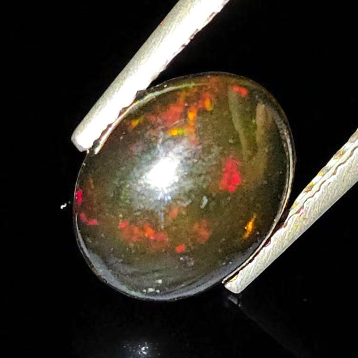 1.22 Ct "Play Of Colors" Natural Black Opal: Gemstones: Natural Black Fire Opal /Carat Weights: 1.22 ct /Size or Dimensions: 9 X 7 X 3.40 mm /Treatment: Heated