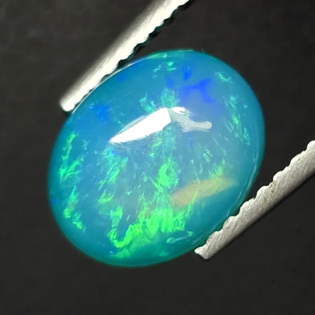 1.28 Ct Natural Ethiopian Green Fire Opal: Gemstones: Natural Fire Opal /Carat Weights: 1.28 ct /Size or Dimensions: 9 X 7 X 3.70 mm /Treatment: Color Dyed