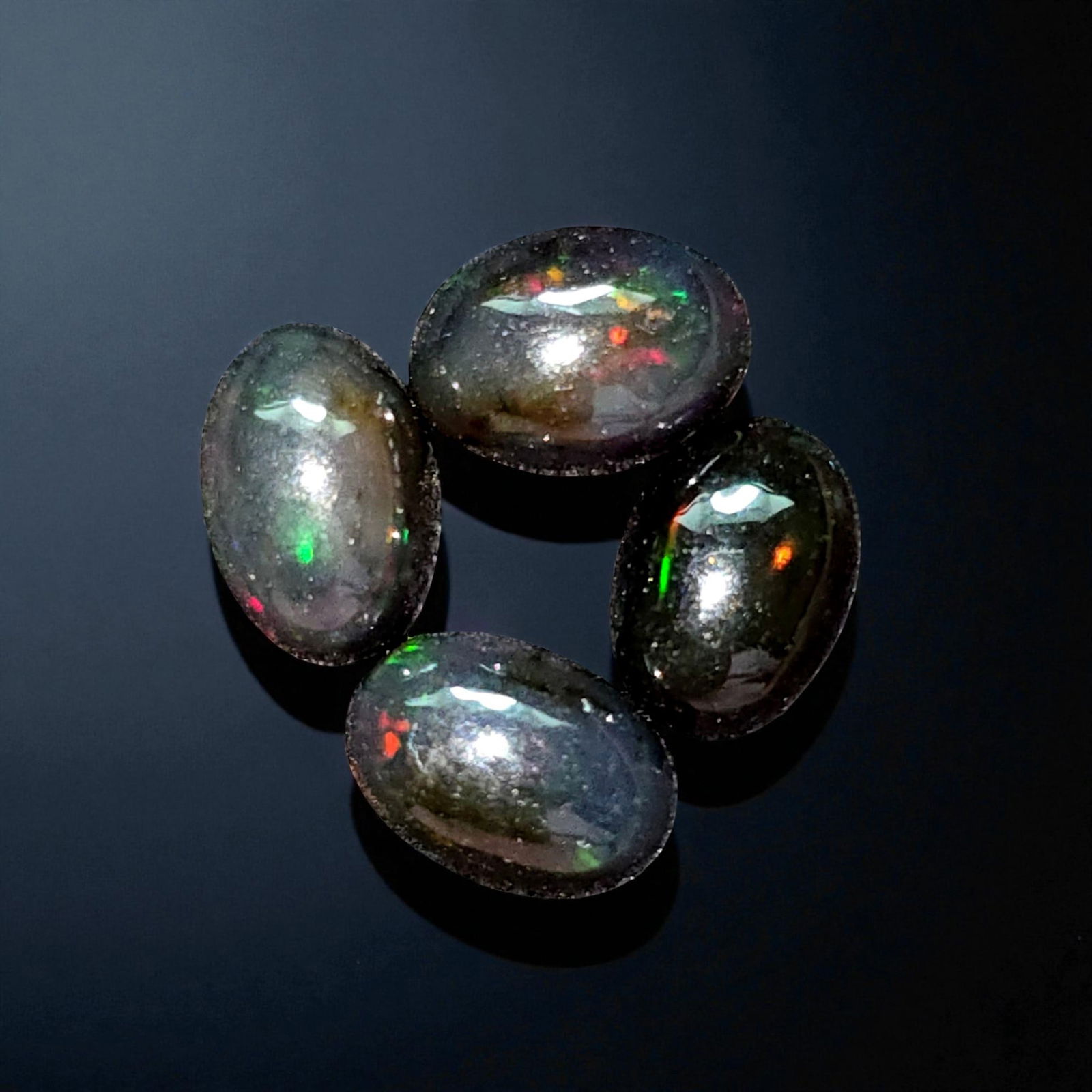 2.12 Ct "Play Of Colors" Natural Black Opal Set: Gemstones: Natural Black Fire Opal /Carat Weights: 2.12 ct /Size or Dimensions: 7 X 5 X 3 mm /Treatment: Heated