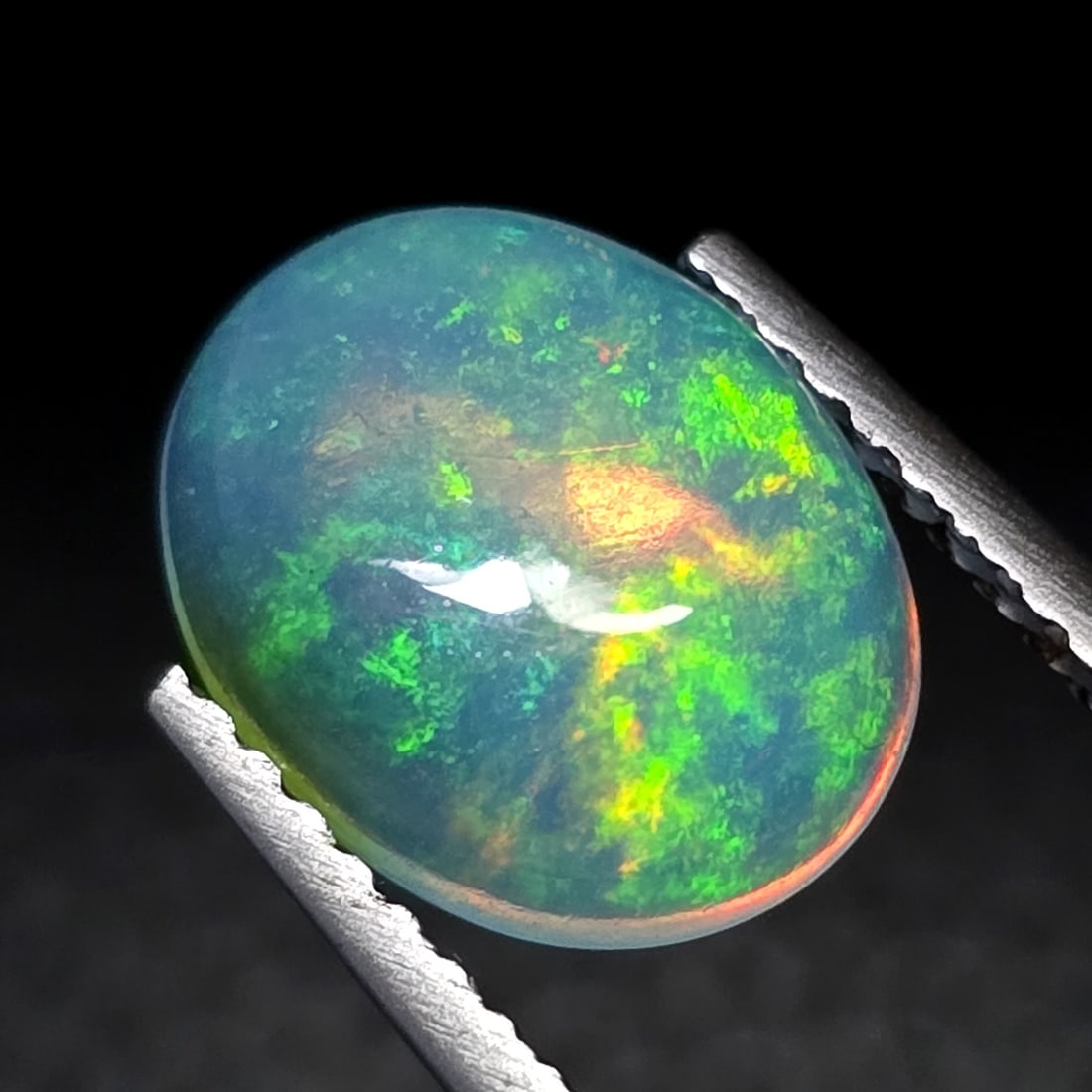 1.38 Ct "Play of Colors" Natural Ethiopian Fire Opal: Gemstones: Natural Fire Opal /Carat Weights: 1.38 ct /Size or Dimensions: 10 X 8 X 3 mm /Treatment: No