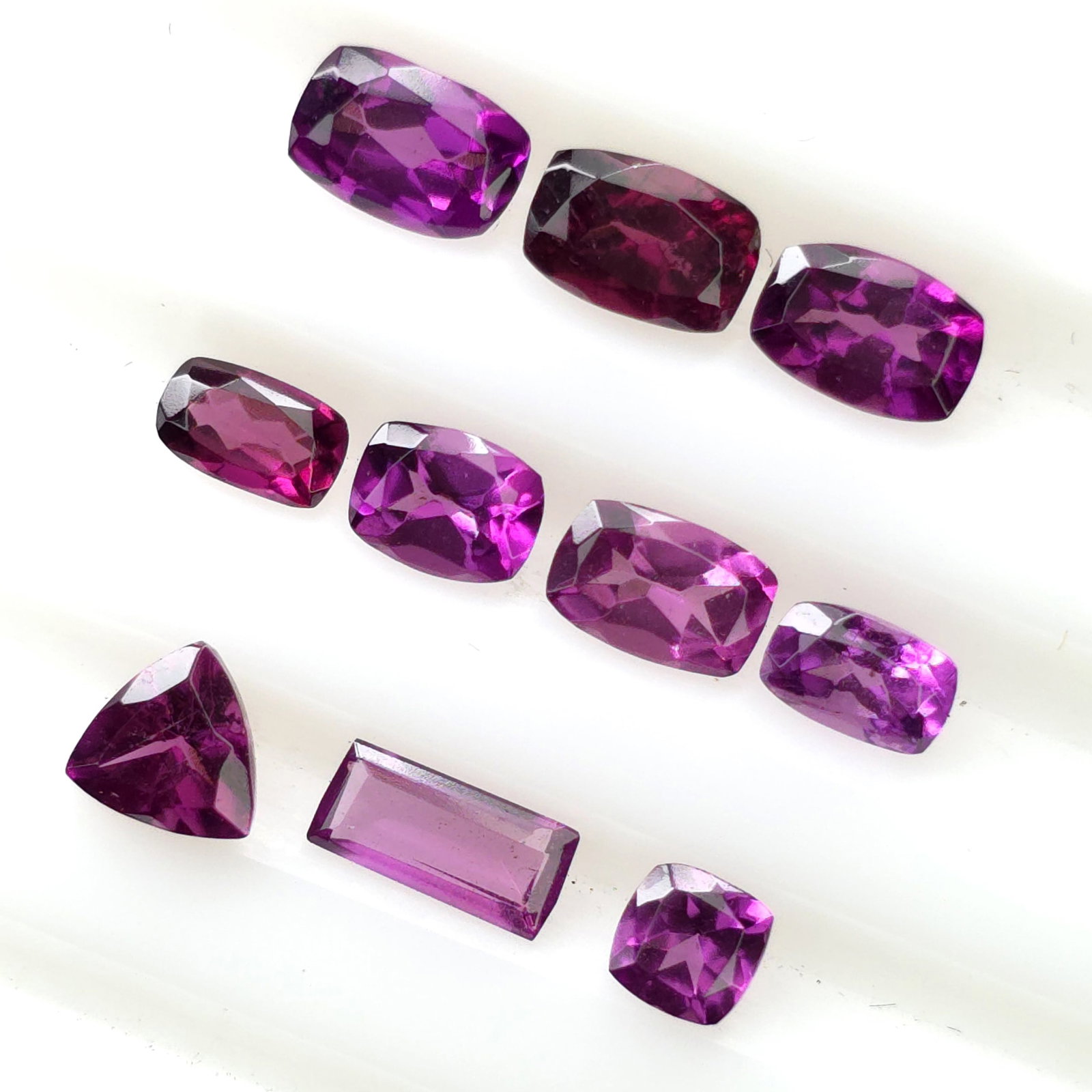 5.18 Ct Natural Rhodolite Set: Gemstones: Rhodolite Garnet /Carat Weights: 5.18 ct /Size or Dimensions: Square(4 X 4), Cushion(5 X 3 To 6 X 4), Baguette(6.70 X 3.10), Trillion(5mm)Approx