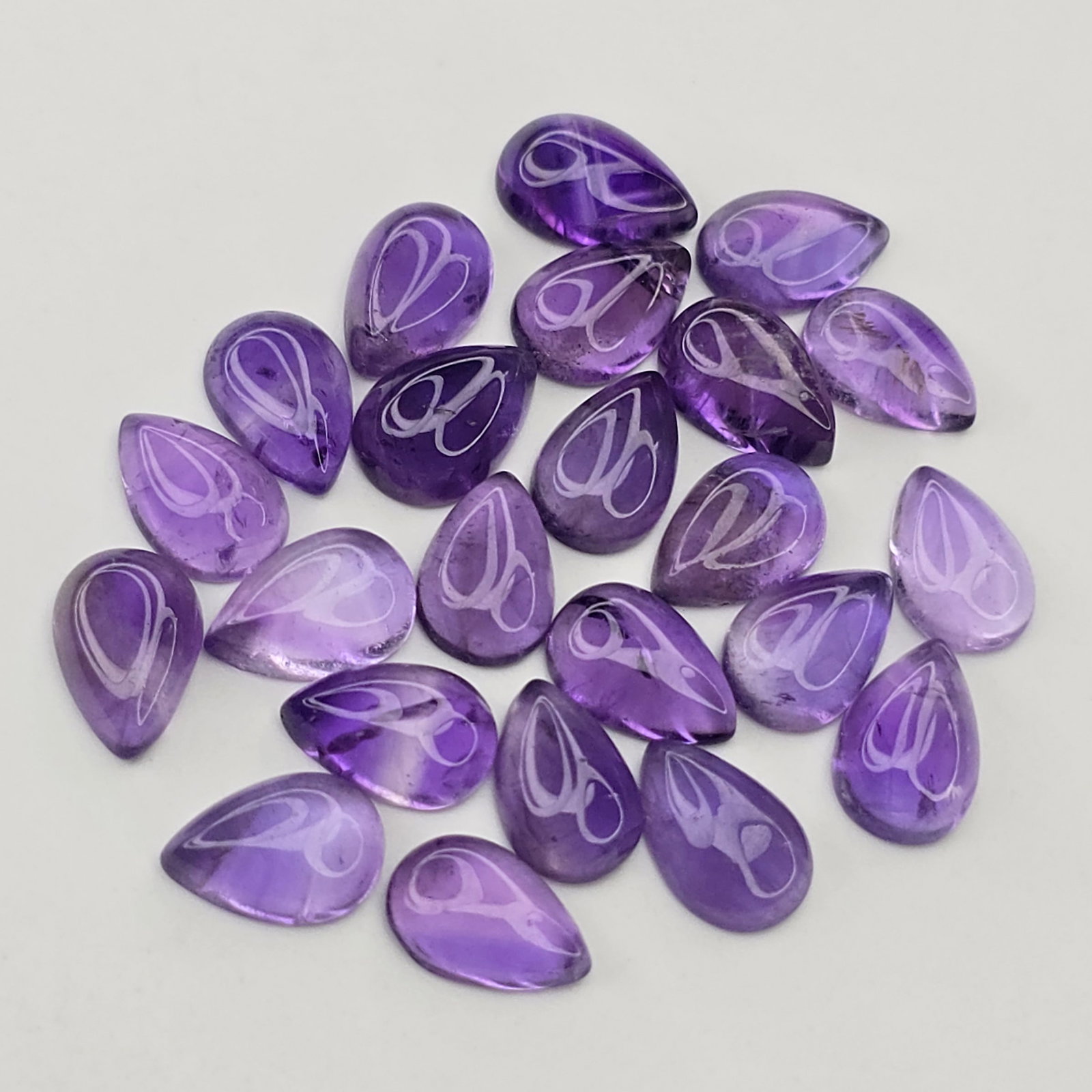 28.29 ct Natural African Amethyst Cab Pear Set: Gemstones: Natural African Amethyst /Carat Weights: 28.29 ct /Size or Dimensions: 9 X 6 mm /Origin : Africa