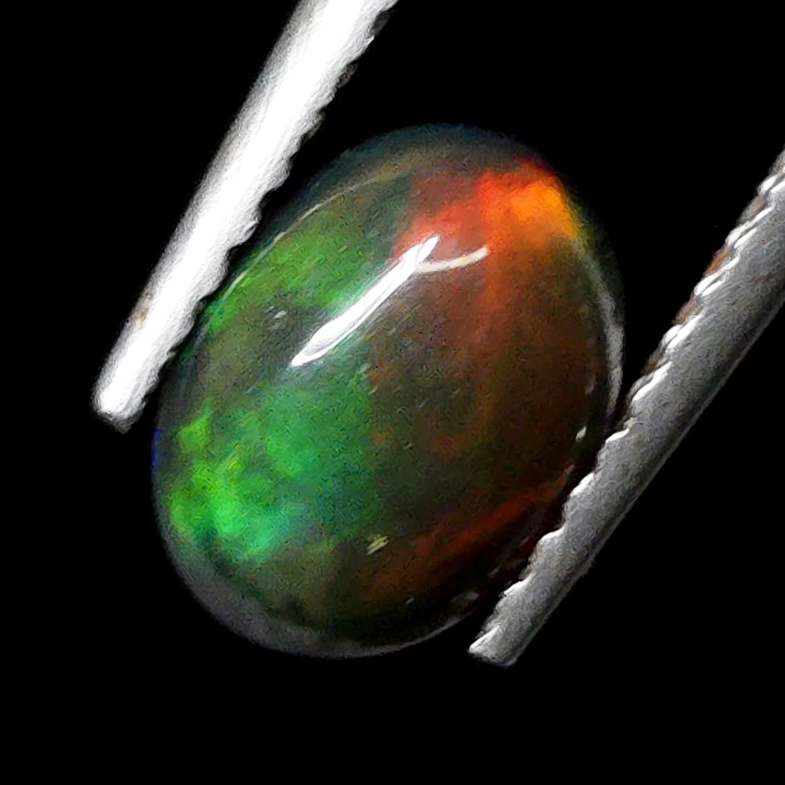 0.74 Ct Natural Ethiopian Green Fire Opal (1 of 5)