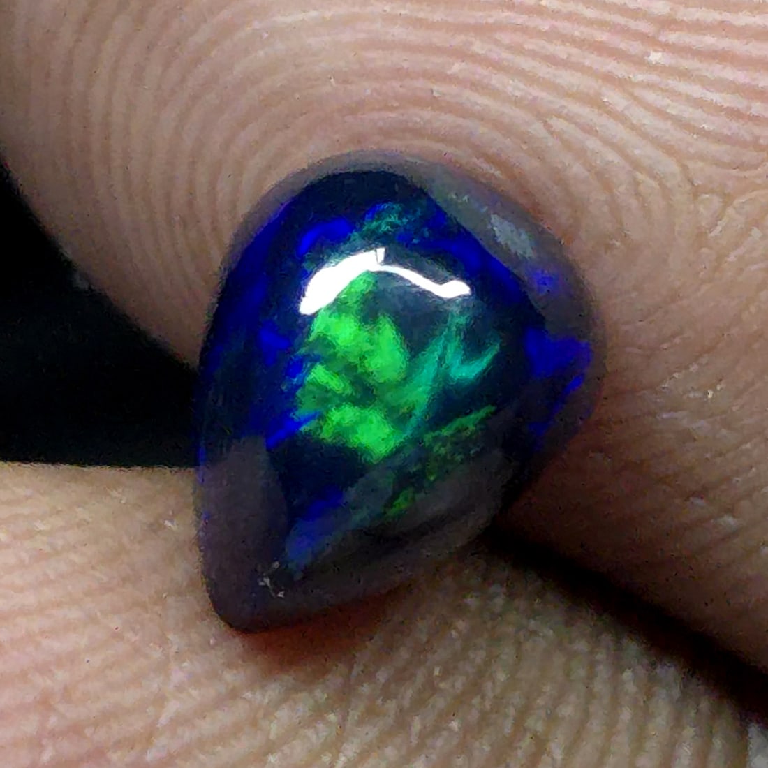 1.56 Ct "Play Of Colors" Natural Black Opal: Gemstones: Natural Black Fire Opal /Carat Weights: 1.03 ct /Size or Dimensions: 7 X 5 mm Approx /Treatment: Heated