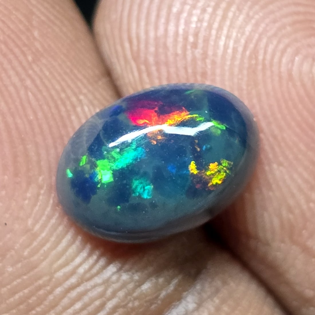 1.38 Ct "Play Of Colors" Natural Black Opal: Gemstones: Natural Black Fire Opal /Carat Weights: 1.38 ct /Size or Dimensions: 10 X 7 X 3.80 mm Approx /Treatment: Heated
