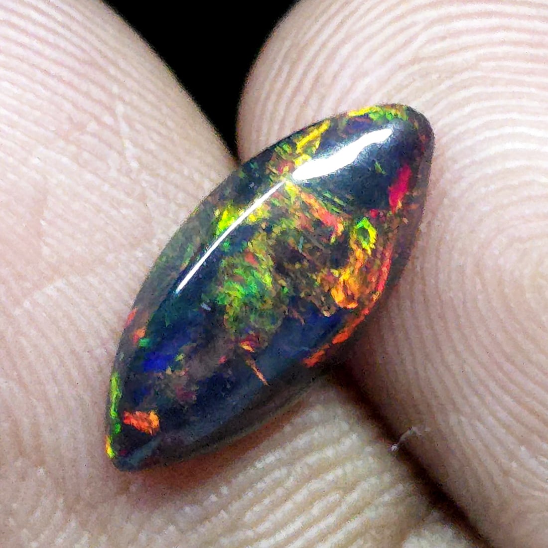 0.87 Ct "Play Of Colors" Natural Black Opal: Gemstones: Natural Black Fire Opal /Carat Weights: 0.87 ct /Size or Dimensions: 13.30 X 6 X 3 mm Approx /Treatment: Heated