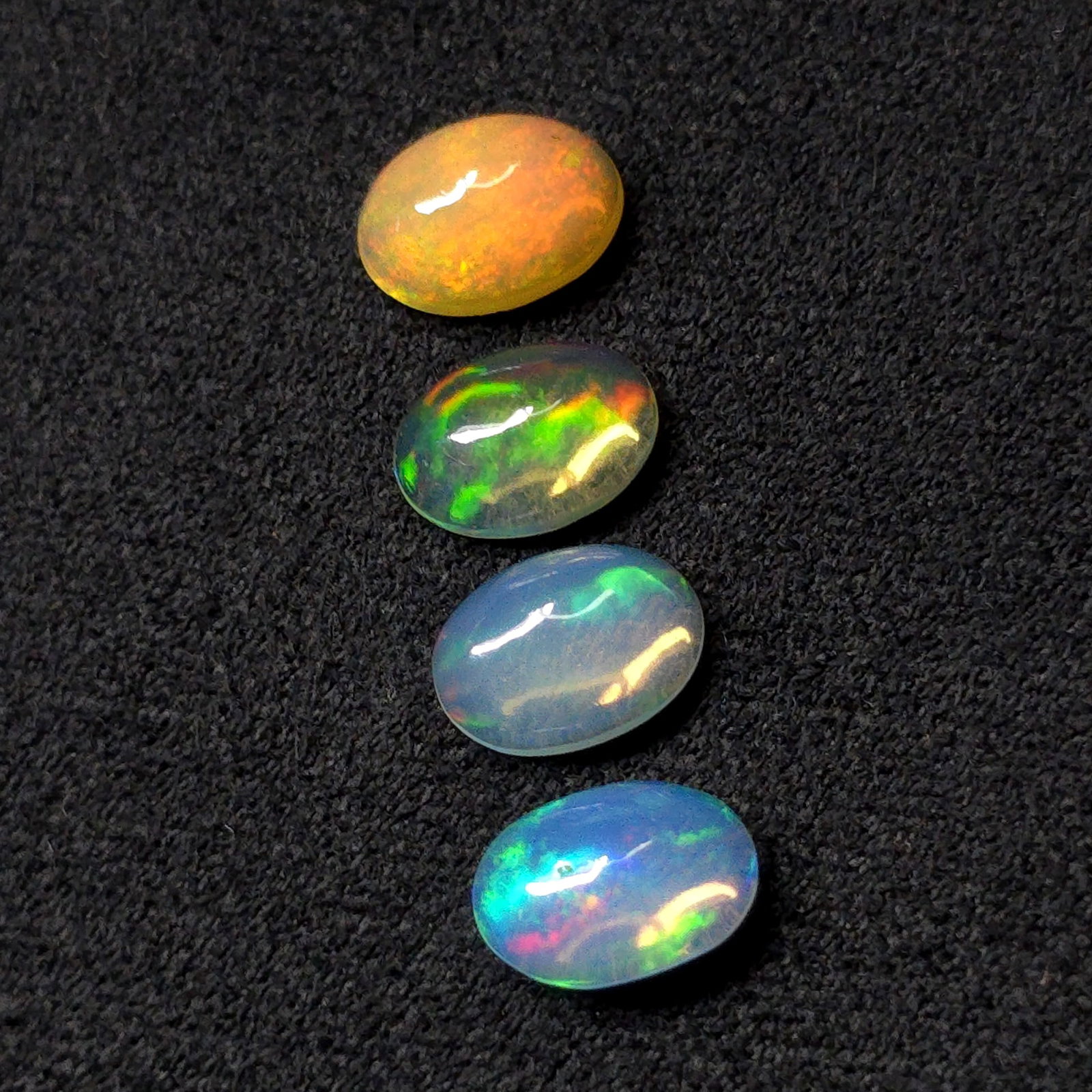 2.15 Ct "Play of Colors" Natural Ethiopian Fire Opal Set: Gemstones: Natural Fire Opal /Carat Weights: 2.15 ct /Size or Dimensions: 7 X 5 mm /Treatment: No