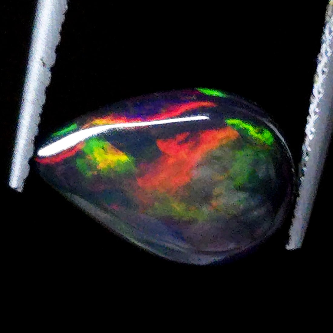 1.20 Ct "Play Of Colors" Natural Black Opal: Gemstones: Natural Black Fire Opal /Carat Weights: 1.20 ct /Size or Dimensions: 11 X 7.50 X 3.00 mm Approx /Treatment: Heated