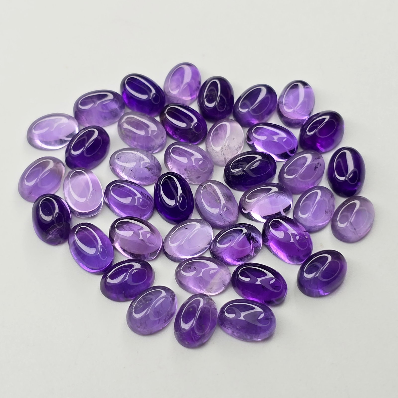 34 ct Natural Amethyst Oval Set: Gemstones: Natural Amethyst /Carat Weights: 34 ct /Size or Dimensions: 7 X 5 mm /Origin : Africa