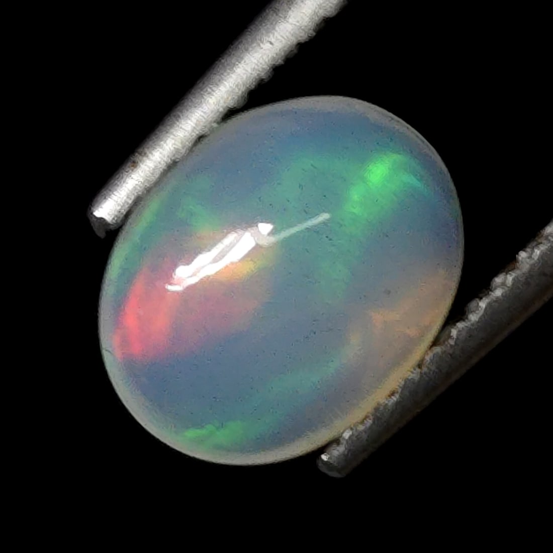 1.06 Ct "Play of Colors" Natural Ethiopian Fire Opal Set: Gemstones: Natural Fire Opal /Carat Weights: 1.06 ct /Size or Dimensions: 9 X 7 X 4 mm /Treatment: No