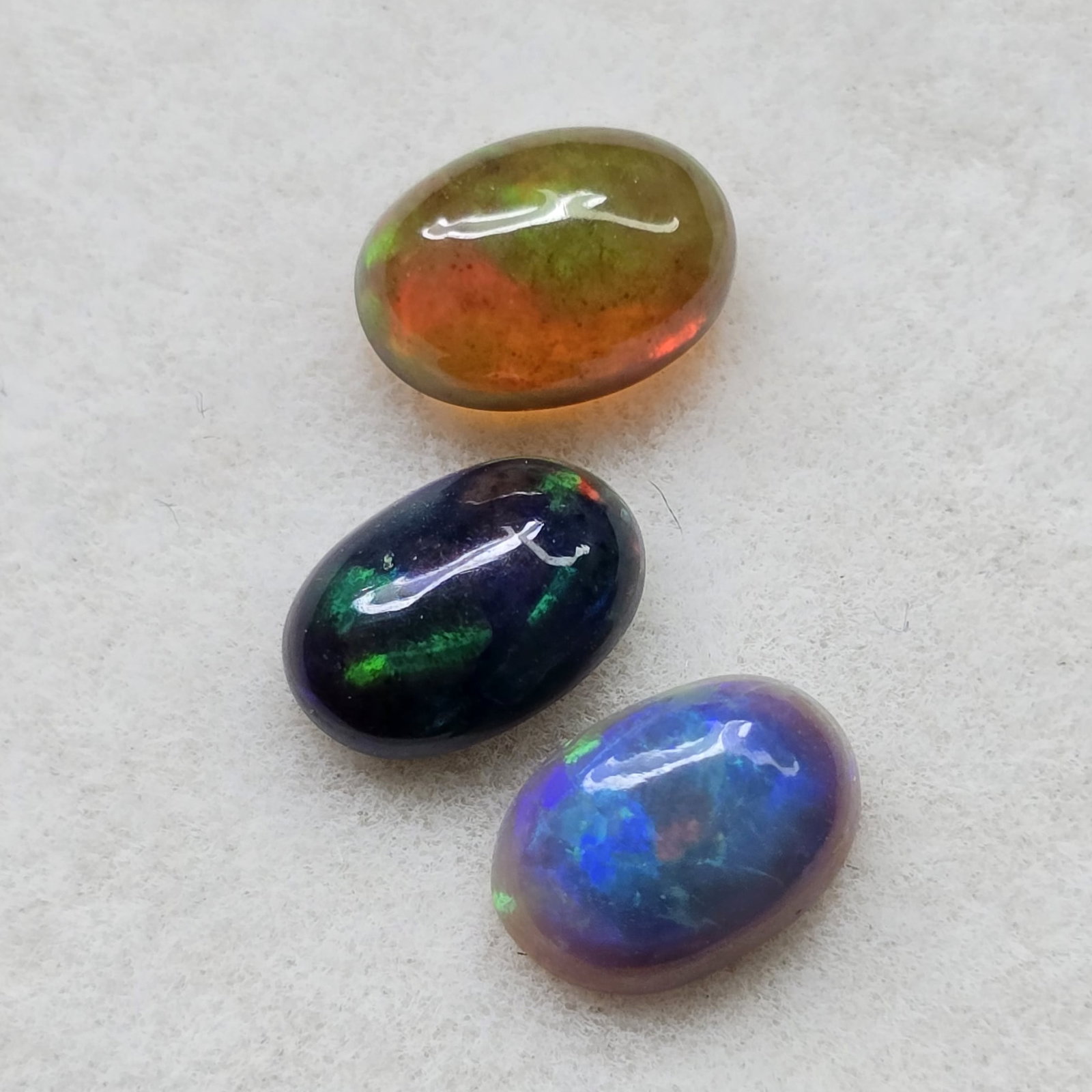 1.43 Ct Natural Ethiopian Green Fire Opal Set: Gemstones: Natural Fire Opal /Carat Weights: 1.43 ct /Size or Dimensions: 7 X 5 mm /Treatment: Color Dyed