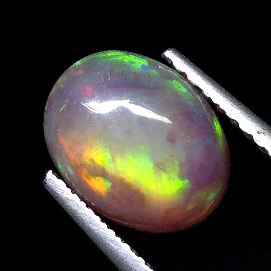 0.87 Ct Natural Ethiopian Green Fire Opal (1 of 5)