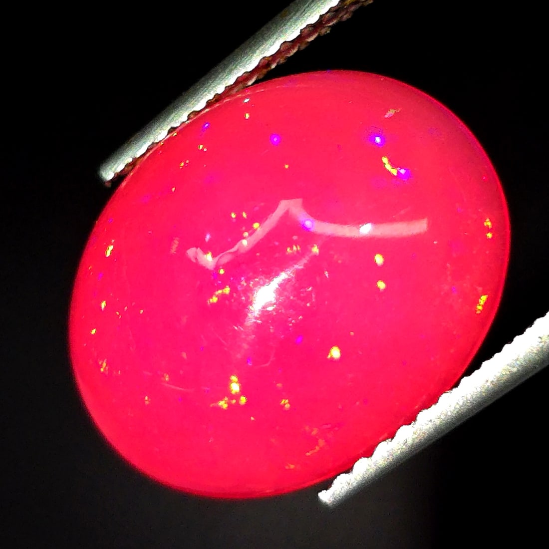 4.20 Ct "Play of Colors" Natural Ethiopian Pink Fire Opal: Gemstones: Natural Fire Opal /Carat Weights: 4.20 ct /Size or Dimensions: 15.36 X 12.46 X 5.07 mm /Treatment: Dyed