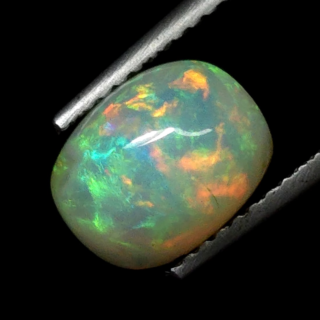 1.39 Ct "Play of Colors" Natural Ethiopian Fire Opal: Gemstones: Natural Fire Opal /Carat Weights: 1.39 ct /Size or Dimensions: 9 X 7 mm /Treatment: No