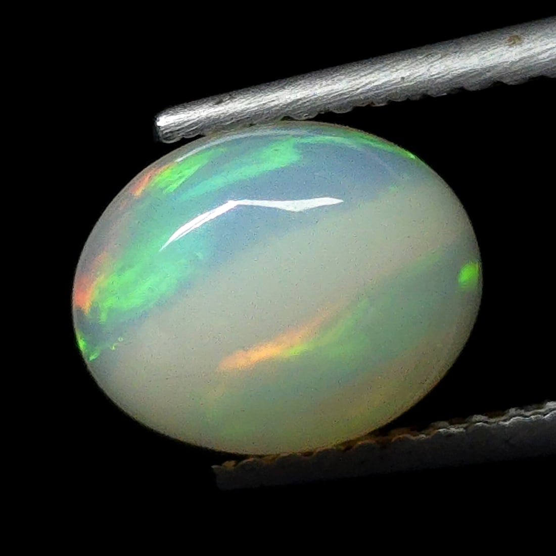 1.32 Ct "Play of Colors" Natural Ethiopian Fire Opal: Gemstones: Natural Fire Opal /Carat Weights: 1.32 ct /Size or Dimensions: 9 X 7 mm /Treatment: No