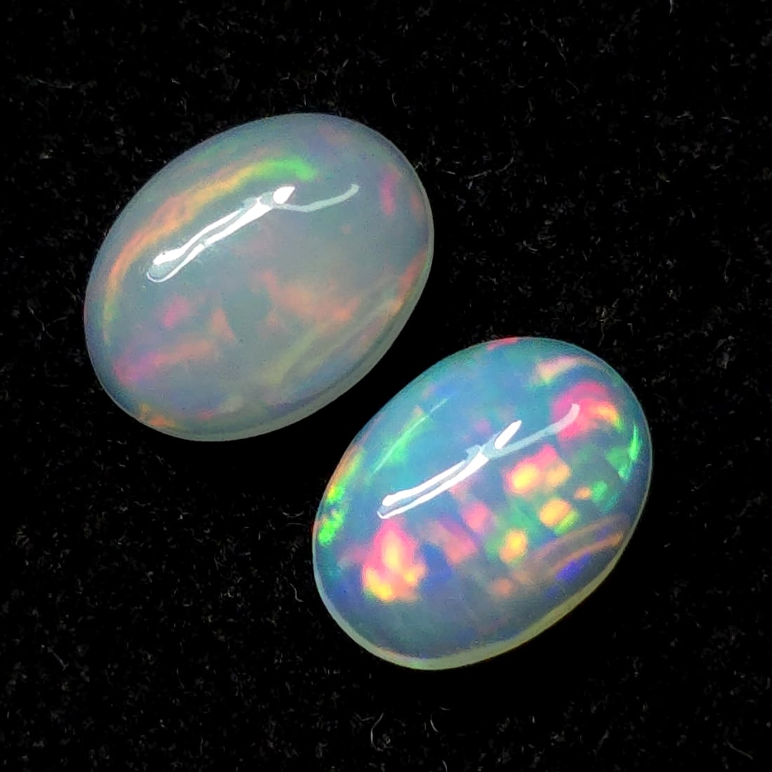 1.53 Ct "Play of Colors" Natural Ethiopian Fire Opal Pair: Gemstones: Natural Fire Opal /Carat Weights: 1.53 ct /Size or Dimensions: 8 X 6 mm /Treatment: No