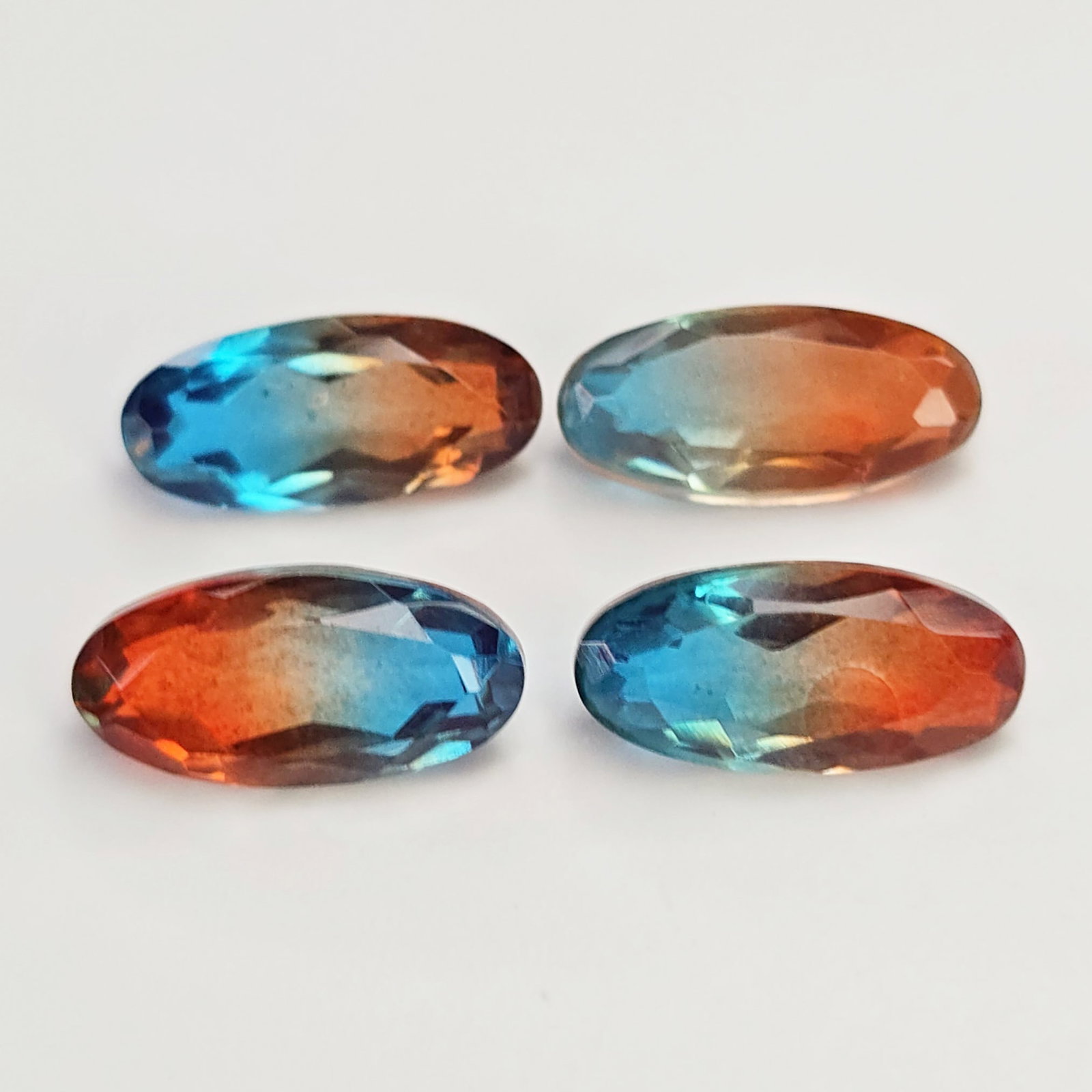 10.47 Ct "Beautiful"Aqua Terra Costa Doublet Quartz Set: Gemstones: Natural Quartz /Carat Weights: 10.47 ct /Size or Dimensions: 13 X 6 mm Approx /Treatment: Doublet QuartzThis beautiful gemstone is crafted from two layers of natural quartz, forming a