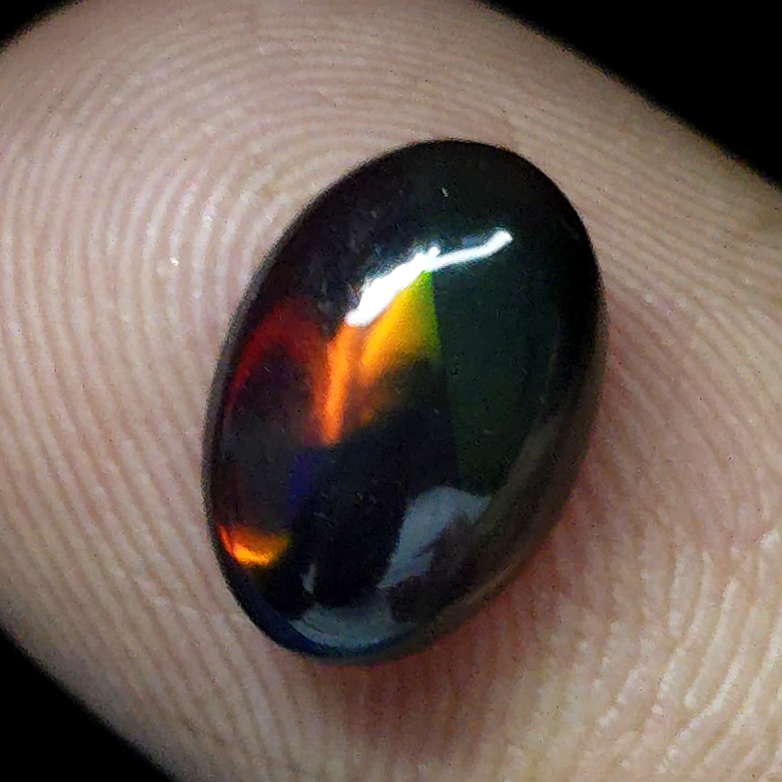 1.11 Ct "Play Of Colors" Natural Black Opal: Gemstones: Natural Black Fire Opal /Carat Weights: 1.11 ct /Size or Dimensions: 10 X 7 X 3 mm Approx /Treatment: Heated