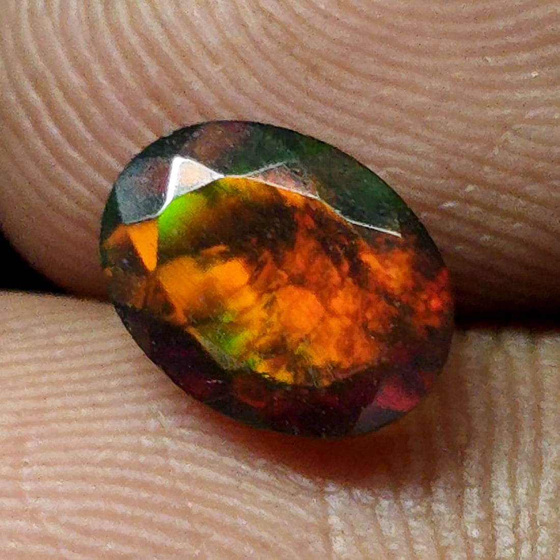 0.85 Ct "Play Of Colors" Natural Black Opal Cut: Gemstones: Natural Black Fire Opal /Carat Weights: 0.85 ct /Size or Dimensions: 8 X 6 X 3.80 mm Approx /Treatment: Heated