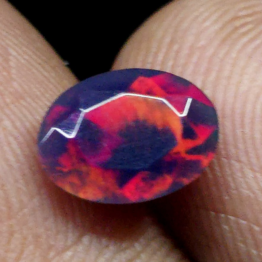0.72 Ct "Play Of Colors" Natural Black Opal Cut: Gemstones: Natural Black Fire Opal /Carat Weights: 0.72 ct /Size or Dimensions: 8 X 6 X 3.70 mm Approx /Treatment: Heated