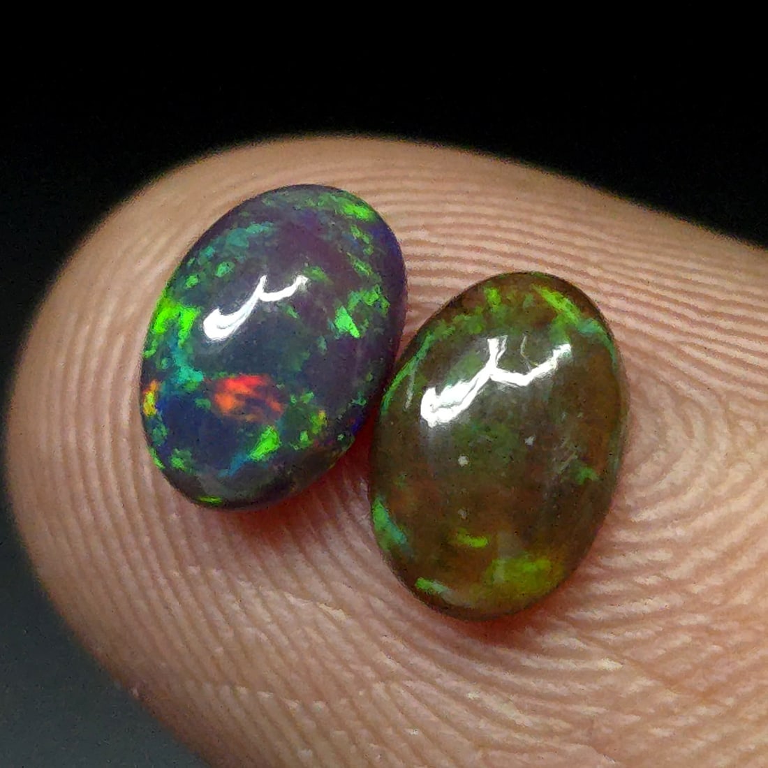 1.03 Ct "Play Of Colors" Natural Black Opal Pair: Gemstones: Natural Black Fire Opal /Carat Weights: 1.03 ct /Size or Dimensions: 7 X 5 mm Approx /Treatment: Heated