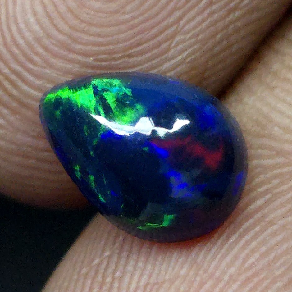 1.31 Ct "Play Of Colors" Natural Black Opal: Gemstones: Natural Black Fire Opal /Carat Weights: 1.31 ct /Size or Dimensions: 9.50 X 7 X 4.50 mm Approx /Treatment: Heated