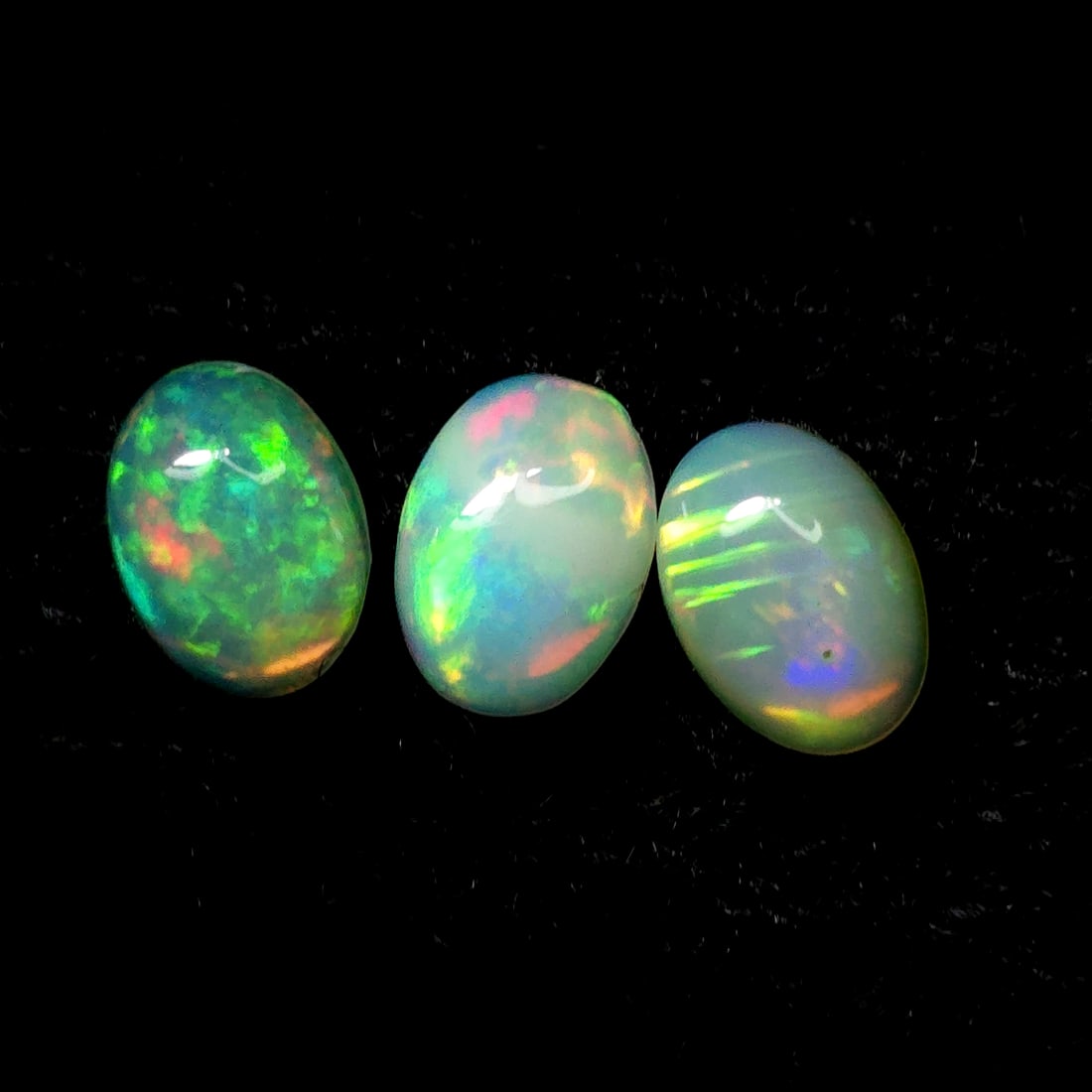 1.57 Ct "Play of Colors" Natural Ethiopian Fire Opal Set: Gemstones: Natural Fire Opal /Carat Weights: 1.57 ct /Size or Dimensions: 7 X 5 mm /Treatment: No