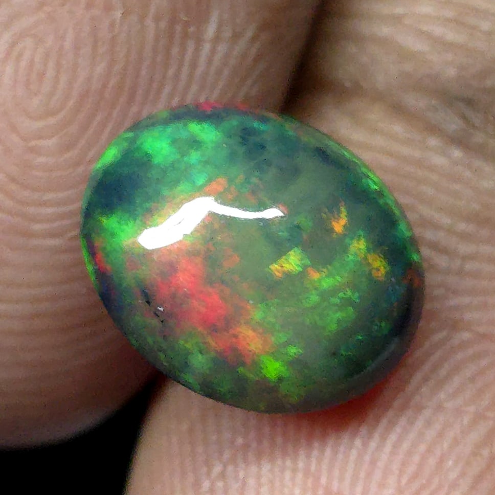 2.33 Ct "Play Of Colors" Natural Black Opal: Gemstones: Natural Black Fire Opal /Carat Weights: 2.33 ct /Size or Dimensions: 10.30 X 8.60 X 5 mm Approx /Treatment: Heated