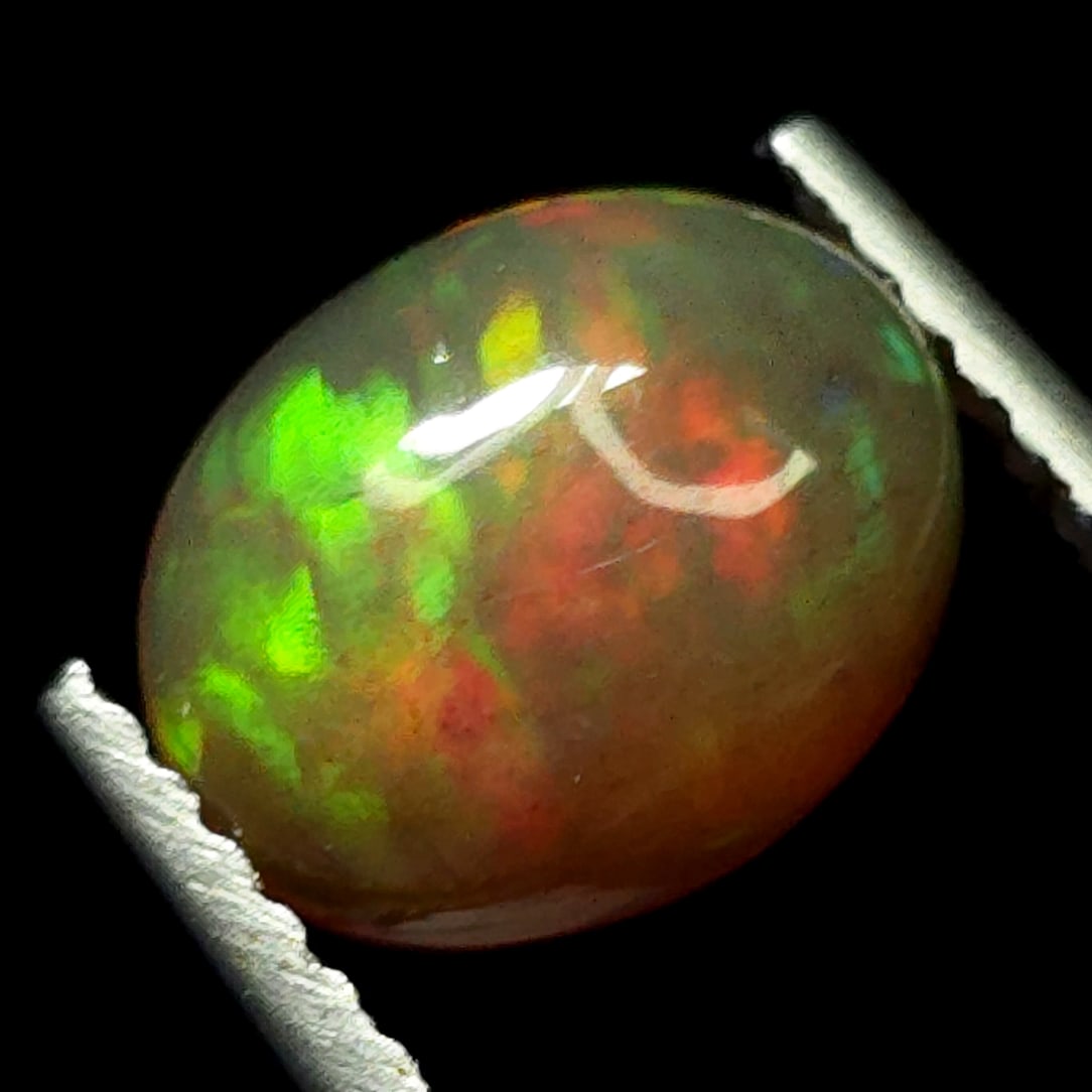 1.18 Ct Natural Ethiopian Pink Fire Opal: Gemstones: Natural Fire Opal /Carat Weights: 1.18 ct /Size or Dimensions: 9 X 7 X 4 mm /Treatment: Color Dyed