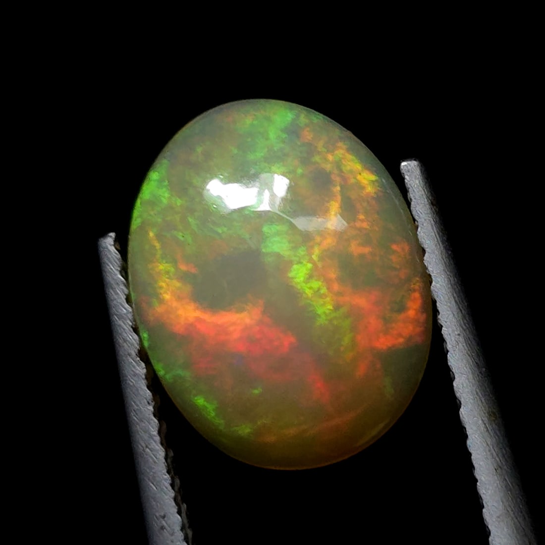 2.04 Ct "Play of Colors" Natural Ethiopian Fire Opal: Gemstones: Natural Fire Opal /Carat Weights: 2.04 ct /Size or Dimensions: 11 X 9 X 4 mm /Treatment: No