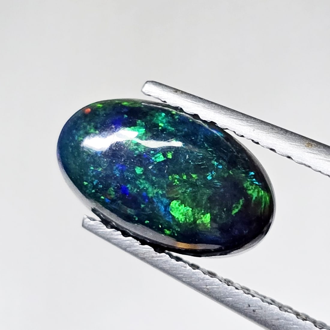 1.18 Ct "Play Of Colors" Natural Black Opal: Gemstones: Natural Black Fire Opal /Carat Weights: 1.18 ct /Size or Dimensions: 10.60 X 6.40 X 3.50 mm Approx /Treatment: Heated