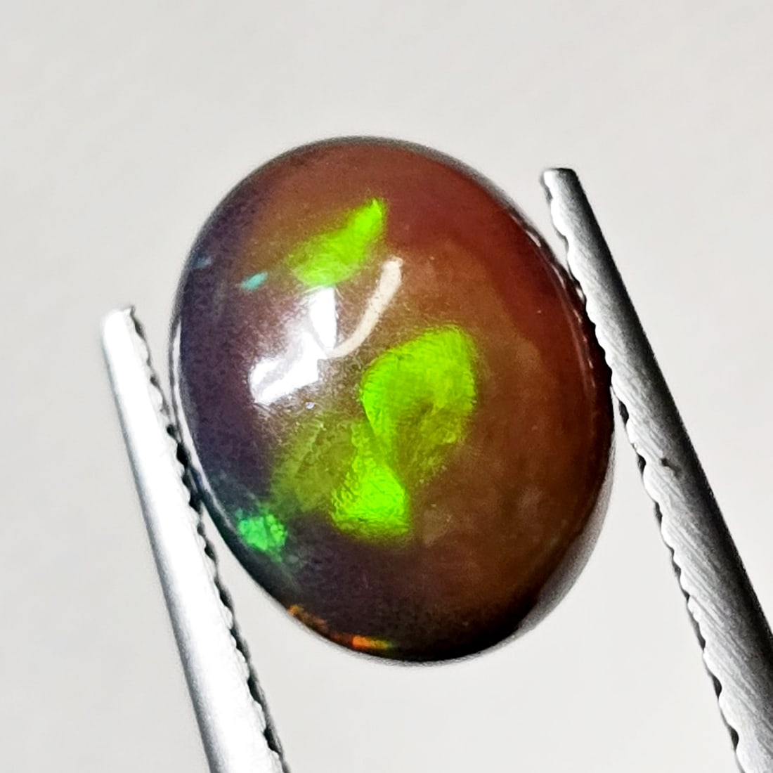 1.24 Ct Natural Ethiopian Green Fire Opal: Gemstones: Natural Fire Opal /Carat Weights: 1.24 ct /Size or Dimensions: 9 X 7 X 4.30 mm /Treatment: Color Dyed