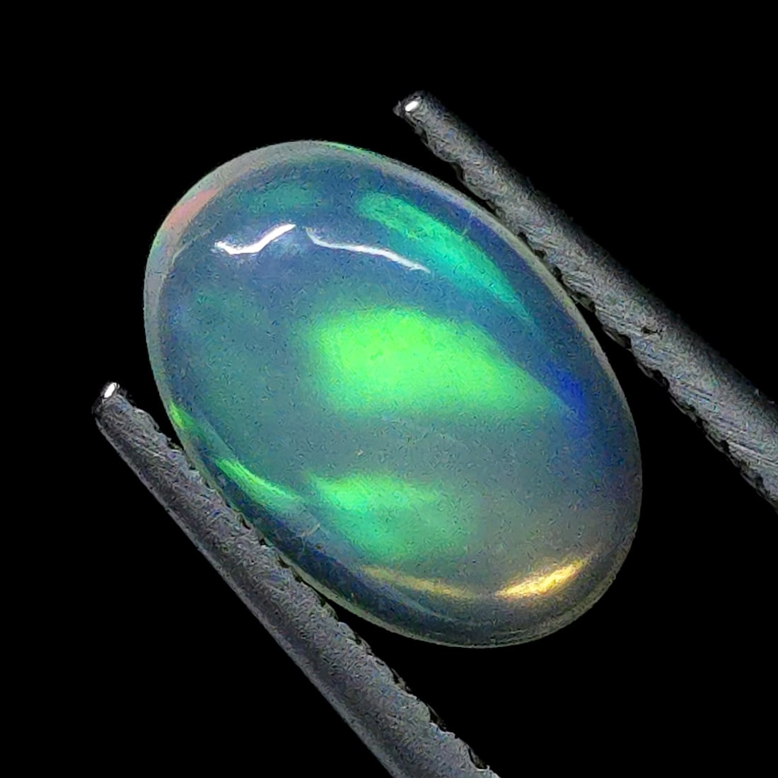 1.04 Ct "Play of Colors" Natural Ethiopian Fire Opal: Gemstones: Natural Fire Opal /Carat Weights: 1.04 ct /Size or Dimensions: 9.40 X 6.40 X 3.40 mm /Treatment: No