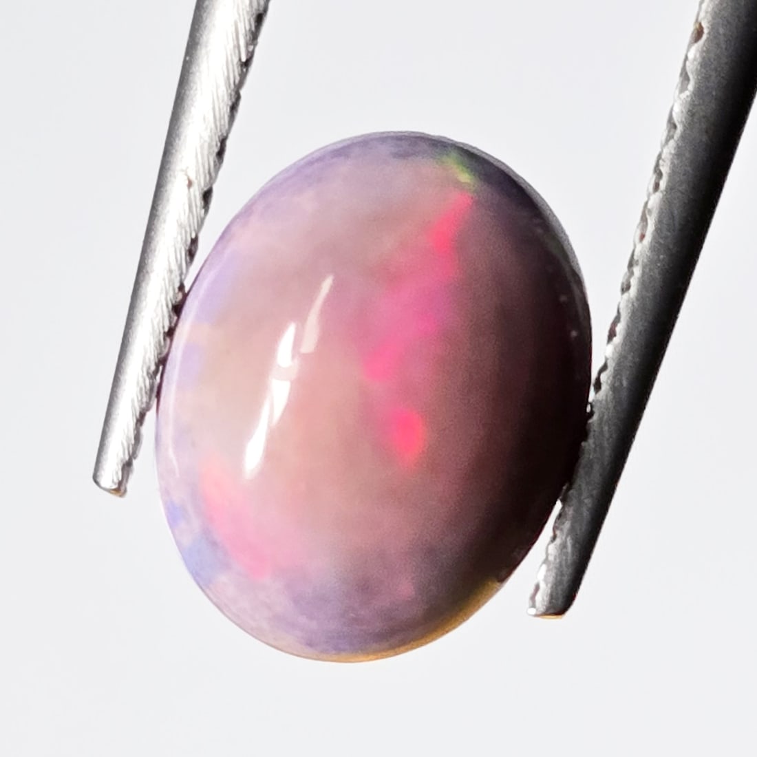 0.98 Ct Natural Ethiopian Pink Fire Opal: Gemstones: Natural Fire Opal /Carat Weights: 0.98 ct /Size or Dimensions: 9 X 7 mm /Treatment: Color Dyed
