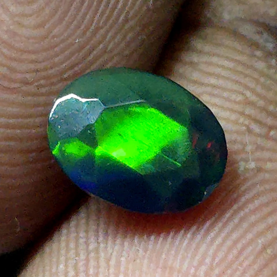 0.87 Ct "Play Of Colors" Natural Black Opal Cut: Gemstones: Natural Black Fire Opal /Carat Weights: 0.87 ct /Size or Dimensions: 8 X 6 mm Approx /Treatment: Heated