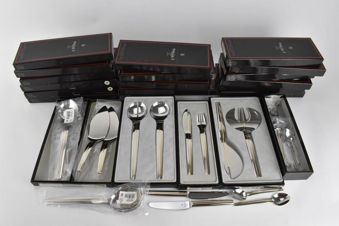 A collection of boxed Art Deco style WMF for Maxim's de: A collection of boxed Art Deco style WMF for Maxim's de Paris cutlery, designed by Pierre Cardin, comprising a set of fifteen boxed (by pairs) fish eaters, together with two boxed fish servers, three