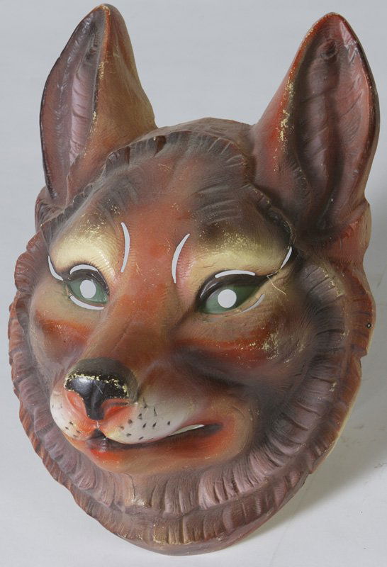 Early 20th C. Celluloid French Mardigras Mask: With a label that says, "Made in France for Van dam"; the mask measures 14-1/2" H x 9" D x 9" W. Condition: Some minor wear to the nose, ears and eyebrows, 2 small 1/2" L fractures on the left eye hol