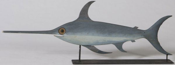 Exceptional Swordfish Weathervane, 19th/Early 20t: Carved from one piece of wood with tin fins, original paint, measures 41" L x 15" H. Condition: Slight flaking to paint on tin fins, old repaired break to tail fin, but very well done. Just an excepti